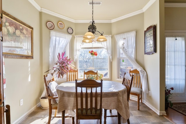 dining area with an inviting chandelier and ornamental molding