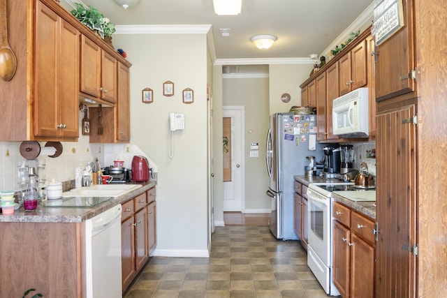 kitchen with tasteful backsplash, crown molding, sink, and white appliances