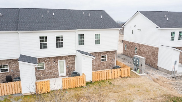 back of property with cooling unit