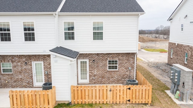 back of property with central AC unit