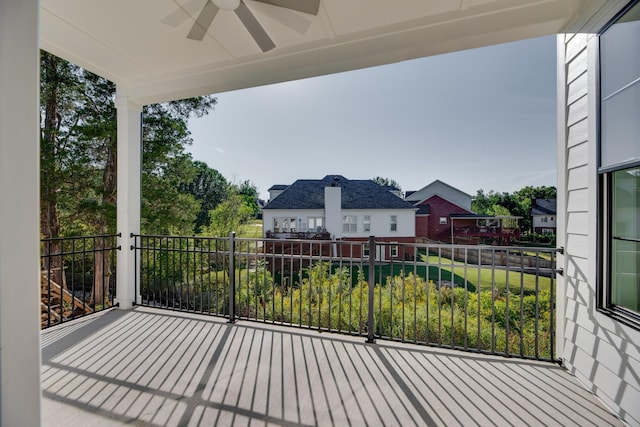 exterior space with ceiling fan and a balcony