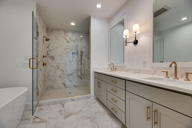 bathroom featuring vanity and separate shower and tub