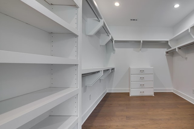 walk in closet featuring dark hardwood / wood-style flooring