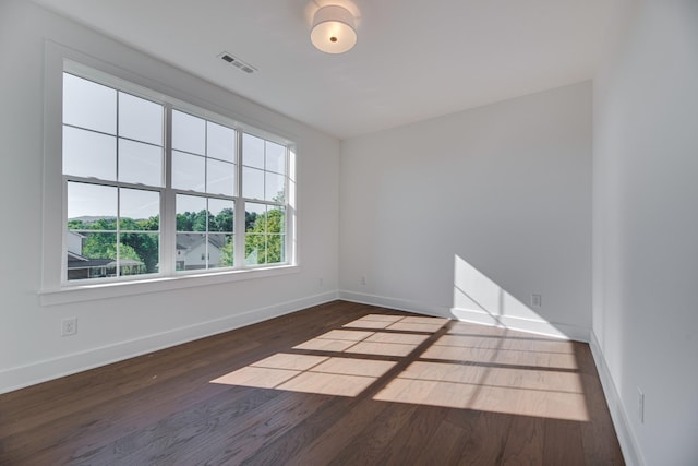 spare room featuring hardwood / wood-style floors