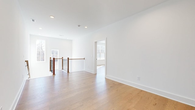 unfurnished room with light wood-type flooring