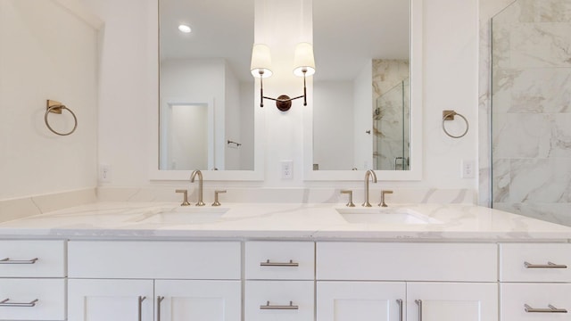 bathroom with vanity and an enclosed shower