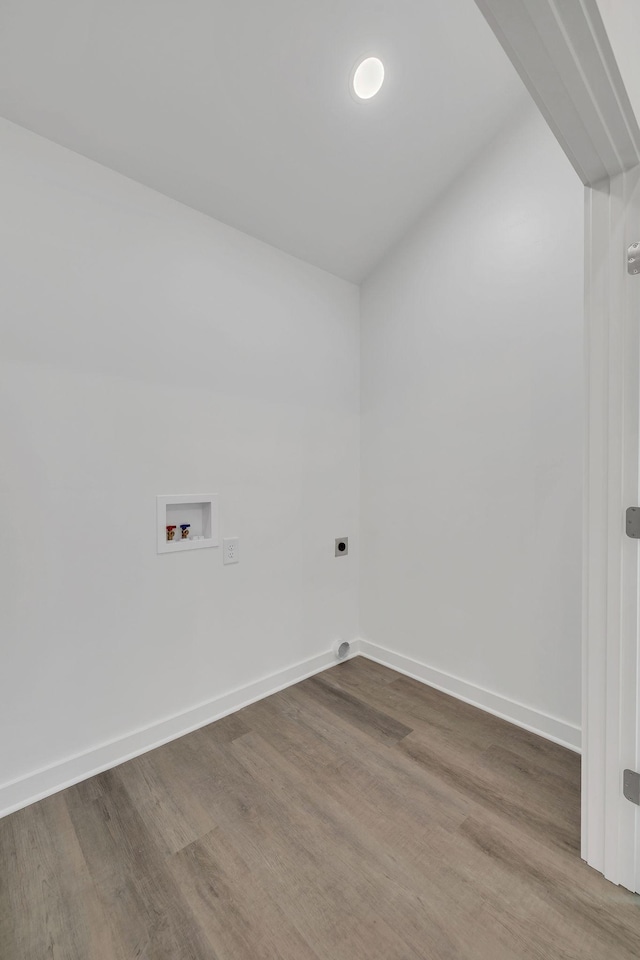 laundry room with hookup for a washing machine, electric dryer hookup, and hardwood / wood-style floors