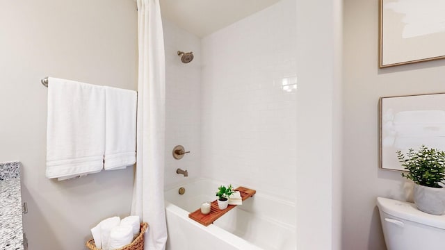 bathroom featuring toilet and shower / bath combo