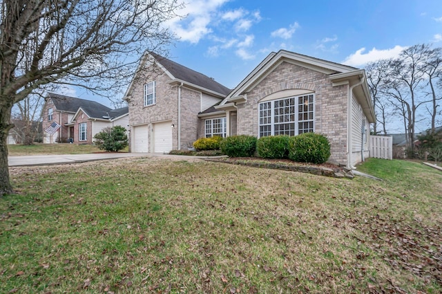 view of front of property featuring a front yard, brick siding, driveway, and an attached garage