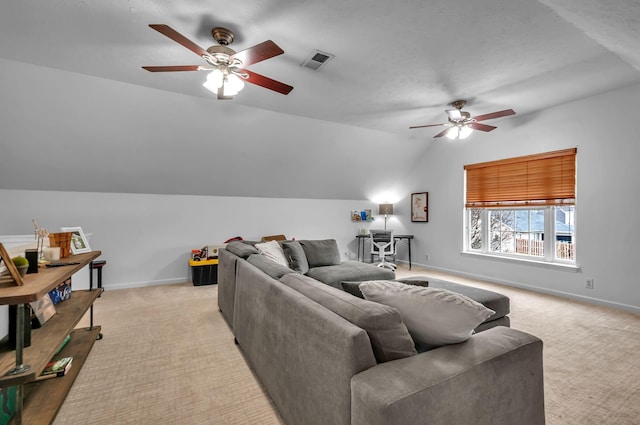 living area with lofted ceiling, visible vents, light carpet, and baseboards