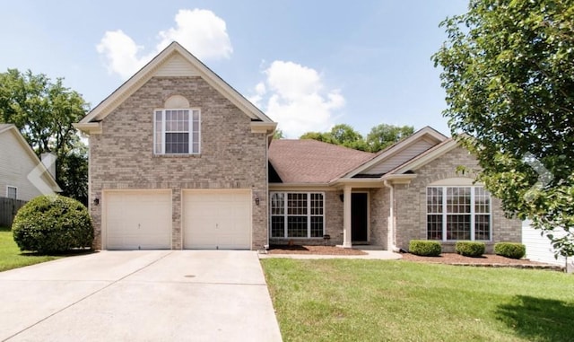 traditional-style house with driveway, a garage, a front lawn, and brick siding