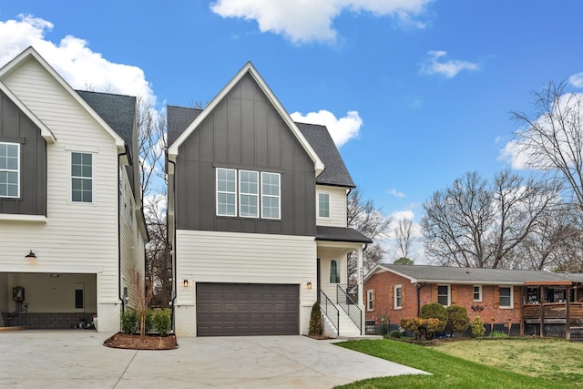 view of front of property with a garage and a front yard