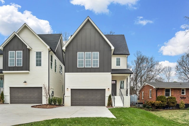 view of front of property featuring a garage and a front lawn