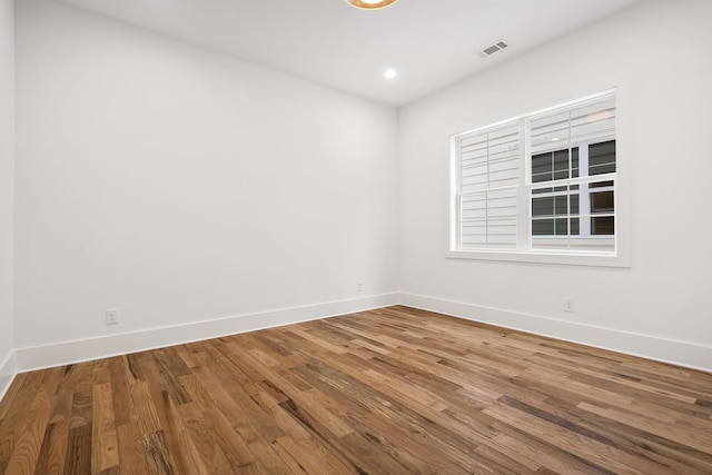 empty room featuring hardwood / wood-style flooring