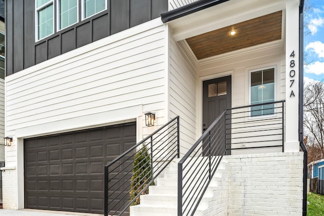 view of exterior entry featuring a garage