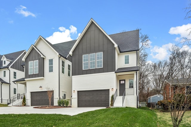 view of front of house featuring a garage and a front yard