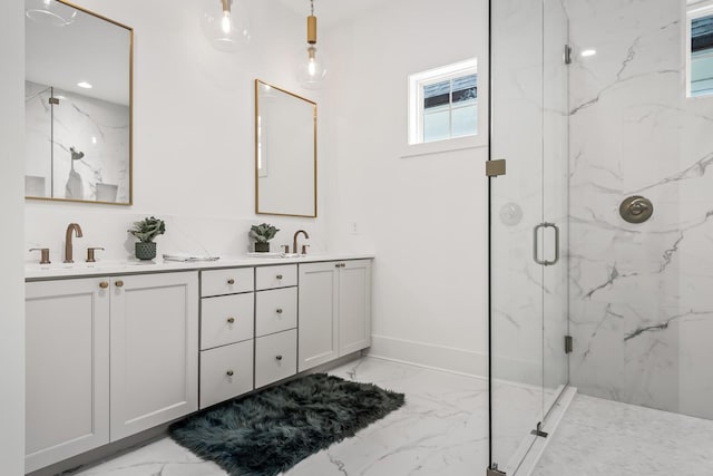 bathroom with vanity and a shower with shower door