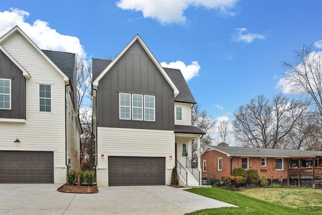 view of front of property featuring a garage and a front lawn