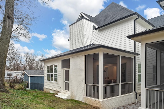 rear view of house with a sunroom