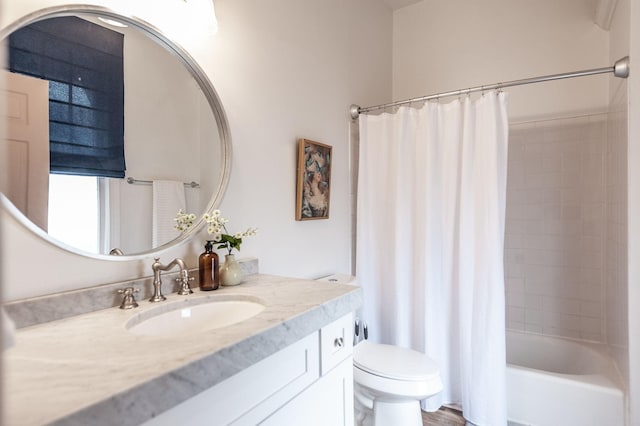 full bathroom with shower / bath combo, vanity, and toilet