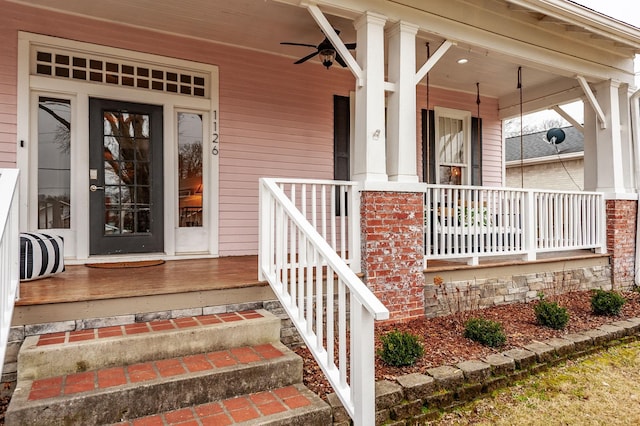 entrance to property with covered porch and ceiling fan