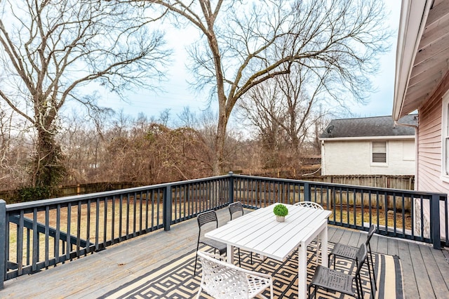 wooden terrace featuring a yard