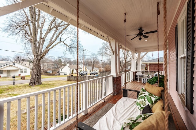 deck with ceiling fan and a porch