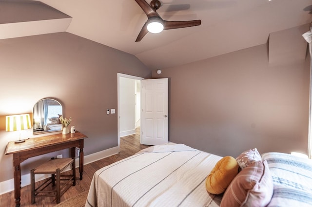 bedroom featuring lofted ceiling, dark hardwood / wood-style floors, and ceiling fan