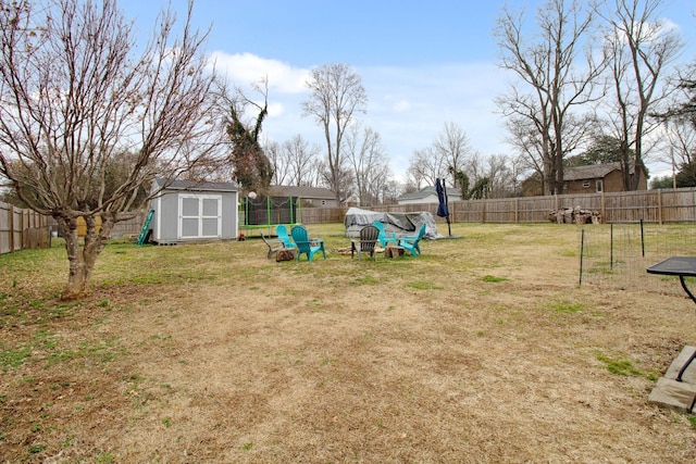 view of yard featuring a storage unit