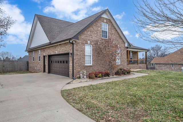 view of home's exterior with a garage, covered porch, and a lawn