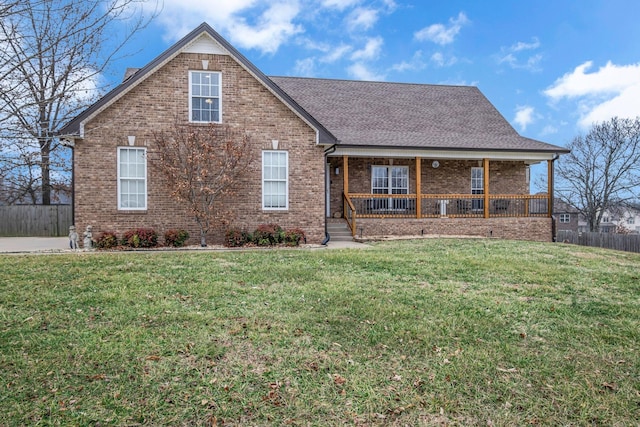 view of front of property featuring a porch and a front yard