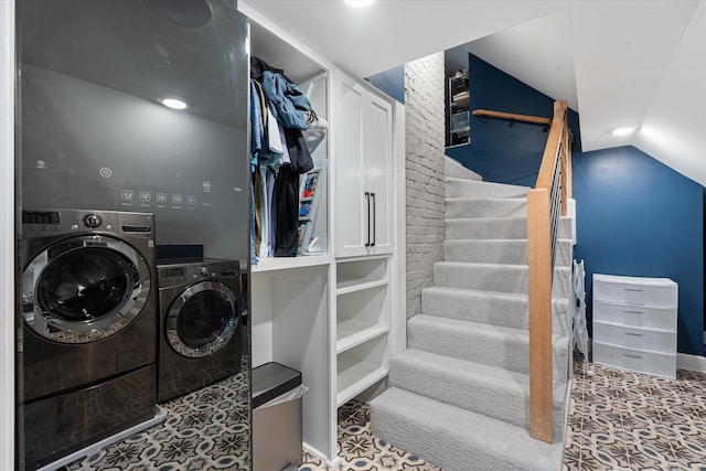 washroom featuring washer and clothes dryer