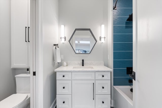 full bathroom with shower / tub combination, vanity, and toilet