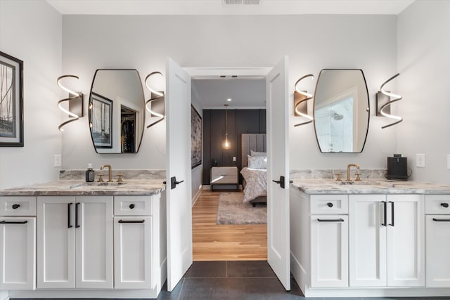 bathroom with vanity and wood-type flooring