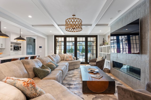 living room with coffered ceiling, beam ceiling, and french doors