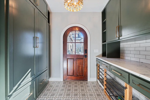 entrance foyer featuring an inviting chandelier