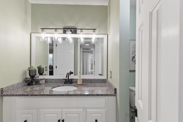 bathroom with vanity and toilet