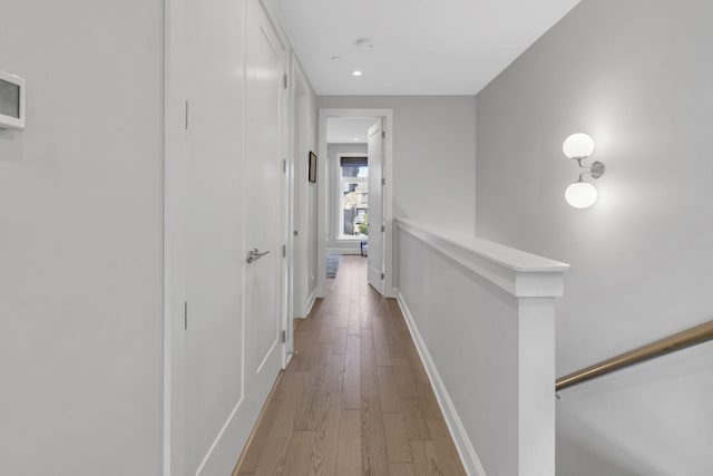 hallway with light wood-type flooring