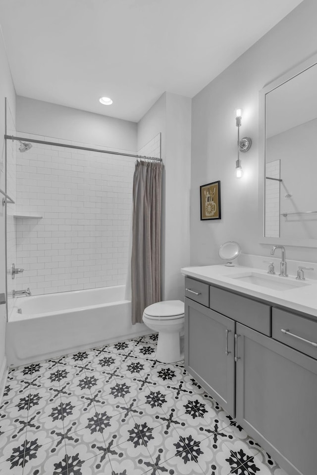 full bathroom with vanity, toilet, and shower / tub combo