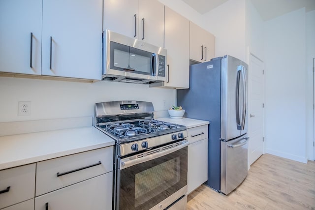 kitchen featuring stainless steel appliances and light wood-type flooring