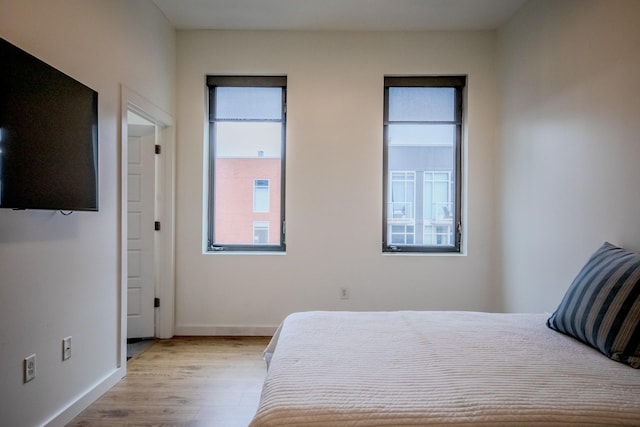 bedroom with light hardwood / wood-style floors