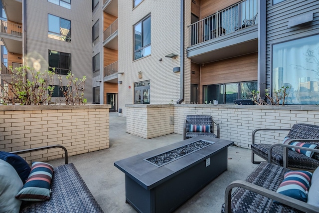 view of patio with a fire pit