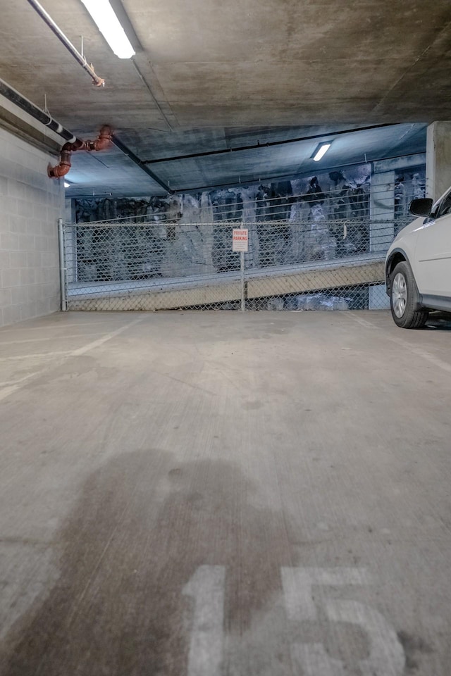 garage featuring concrete block wall