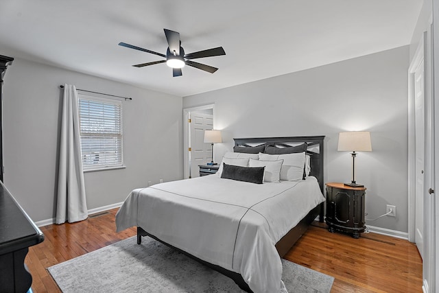 bedroom featuring hardwood / wood-style flooring and ceiling fan