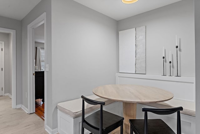 dining area featuring light hardwood / wood-style floors and breakfast area