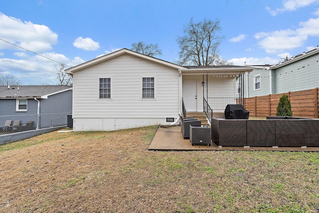 back of property with central AC unit, a yard, outdoor lounge area, and a patio