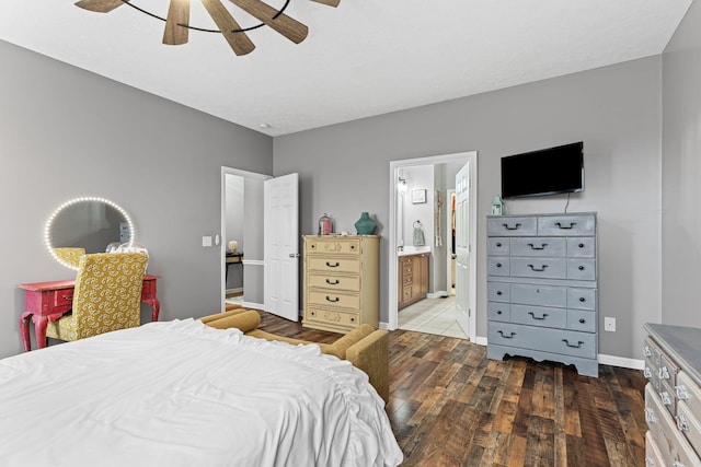 bedroom with dark hardwood / wood-style flooring, ceiling fan, and ensuite bathroom