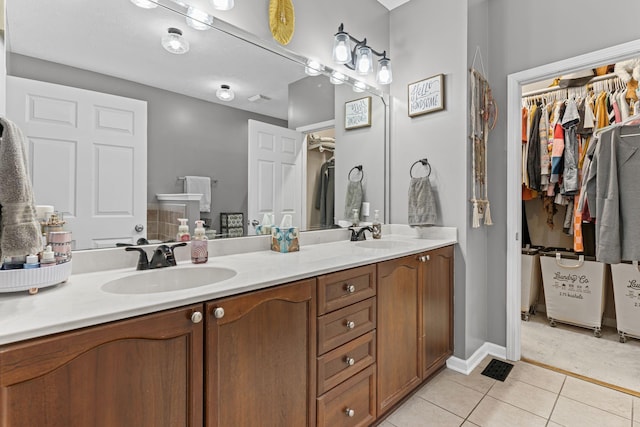 bathroom with vanity and tile patterned floors