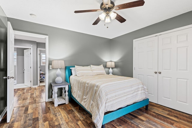 bedroom with ceiling fan, dark hardwood / wood-style flooring, and a closet