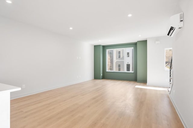 unfurnished living room with light hardwood / wood-style flooring